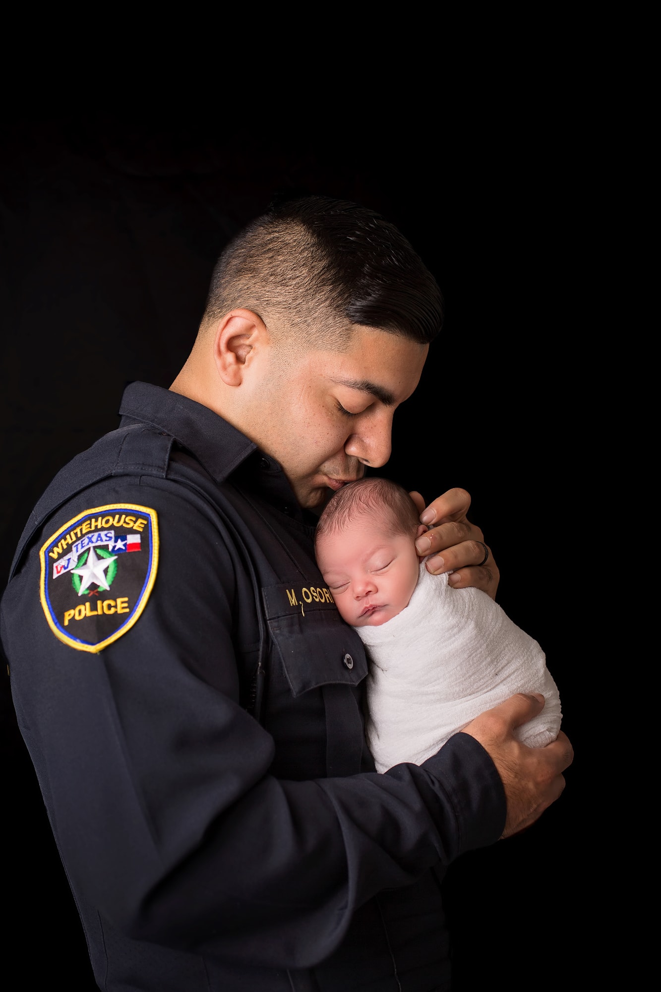 newborn girl with daddy cop