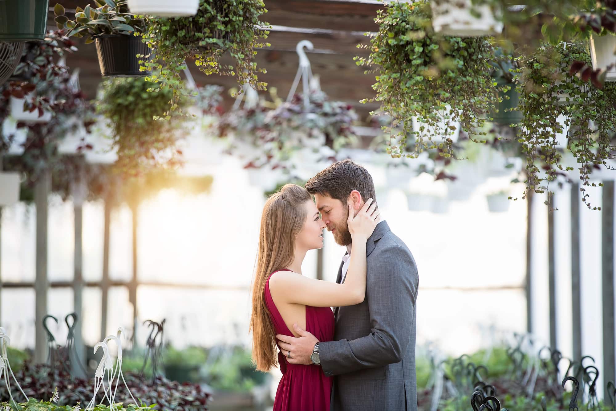 Dallas/Fort Worth & East Texas Photographer couple red greenhouse greenery engagement love